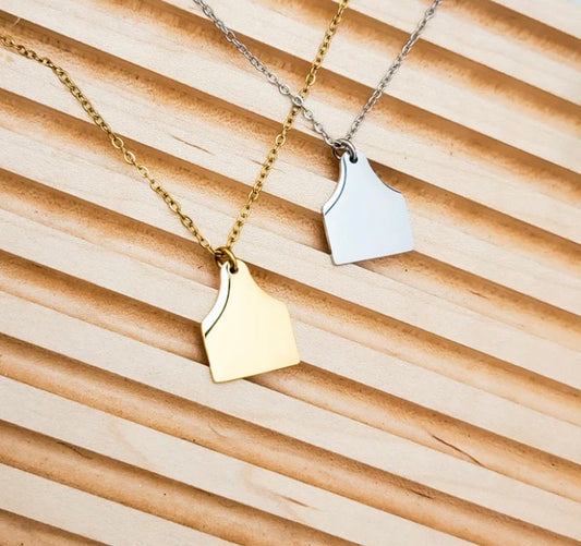 gold and silver necklaces with cow tag pendants engravable