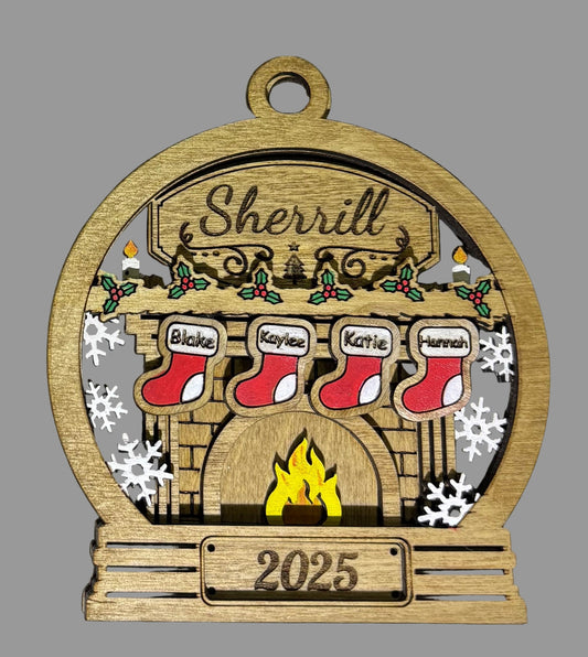 Wooden Christmas ornament with 'Sherrill' family names and stockings in front of a fireplace, featuring the year '2025'.
