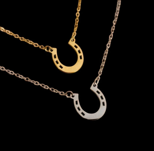 Gold and silver horseshoe-shaped pendants on chains engravable